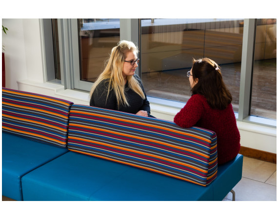 two women talking to each other