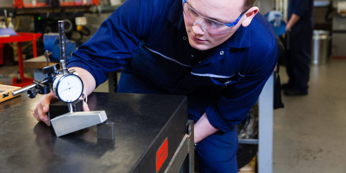 Engineering Practice Student Measuring Metal