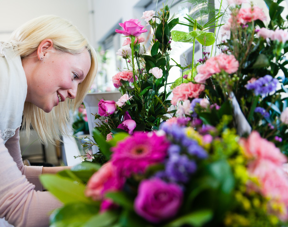 Floristry Student With Large Floral Arrangement