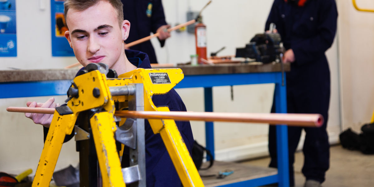 Plumbing Student Working With Copper Pipe