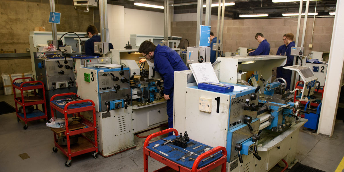 Mechanical Engineering Students In Workshop