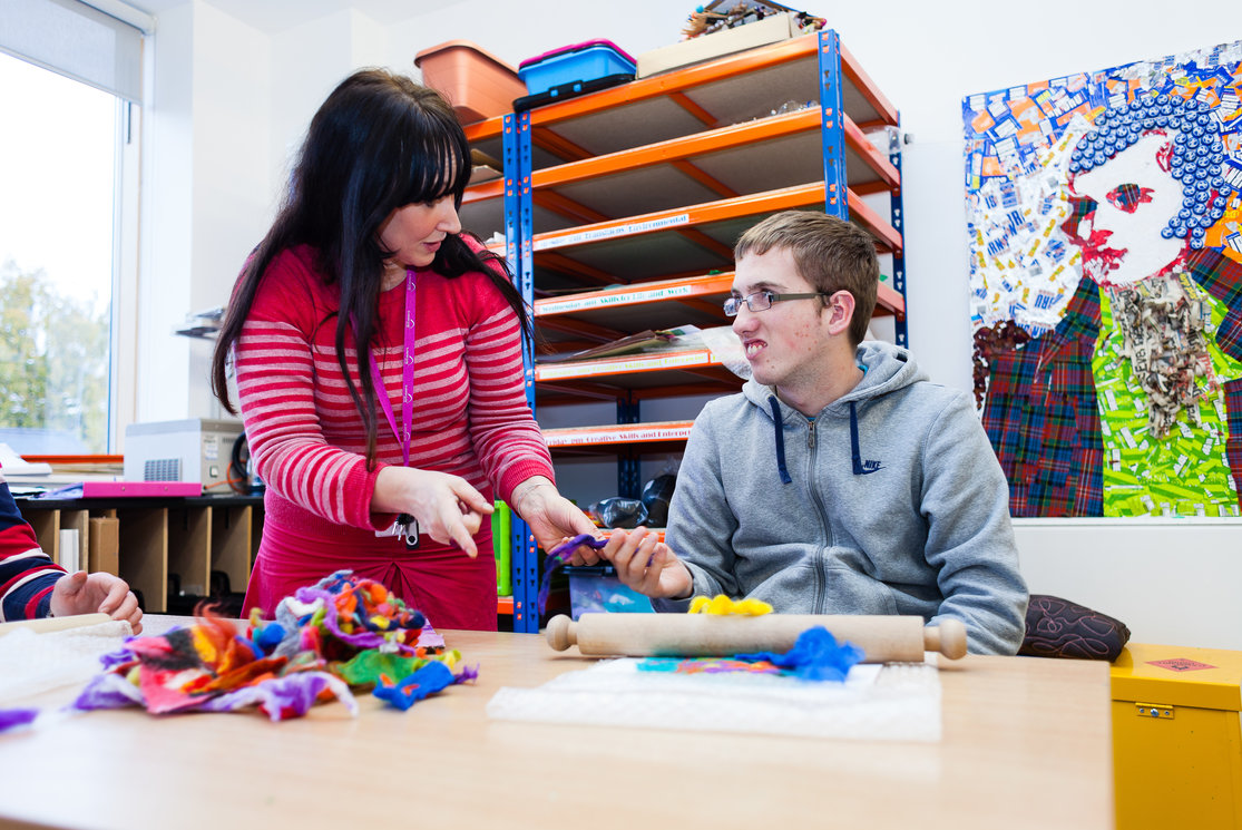 Additional support for learning. student working with coloured clays gallery