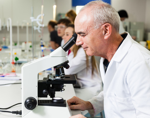 Science Student With Microscope