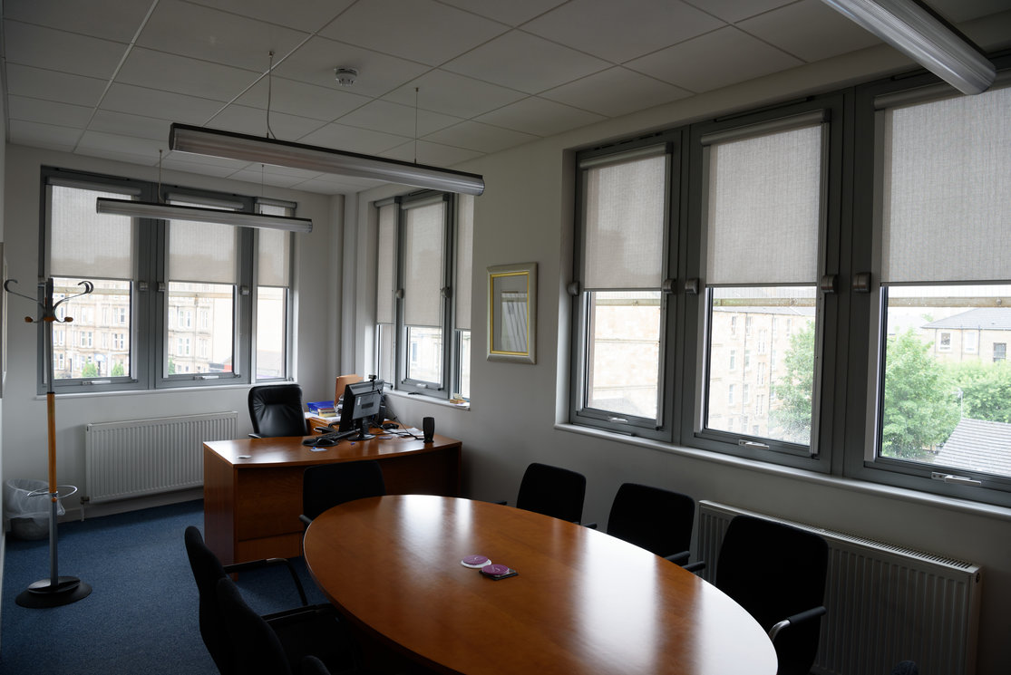 Langside corner office with meeting table gallery