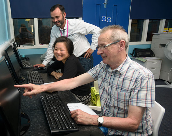 community class man pointing at PC