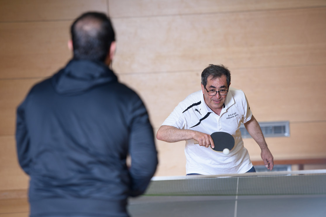 Community class men playing table tennis gallery