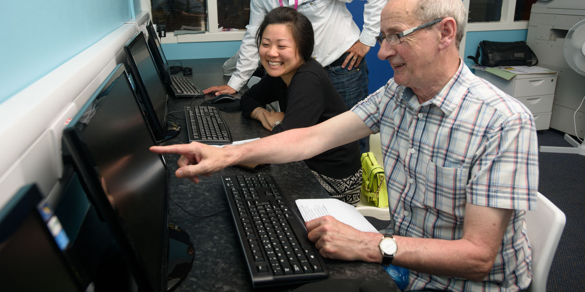 community class man pointing at PC