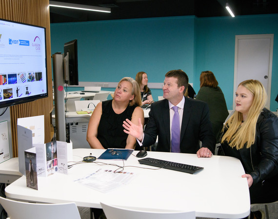 Jon Vincent, Principal of Glasgow Clyde College, viewing a presentation 
