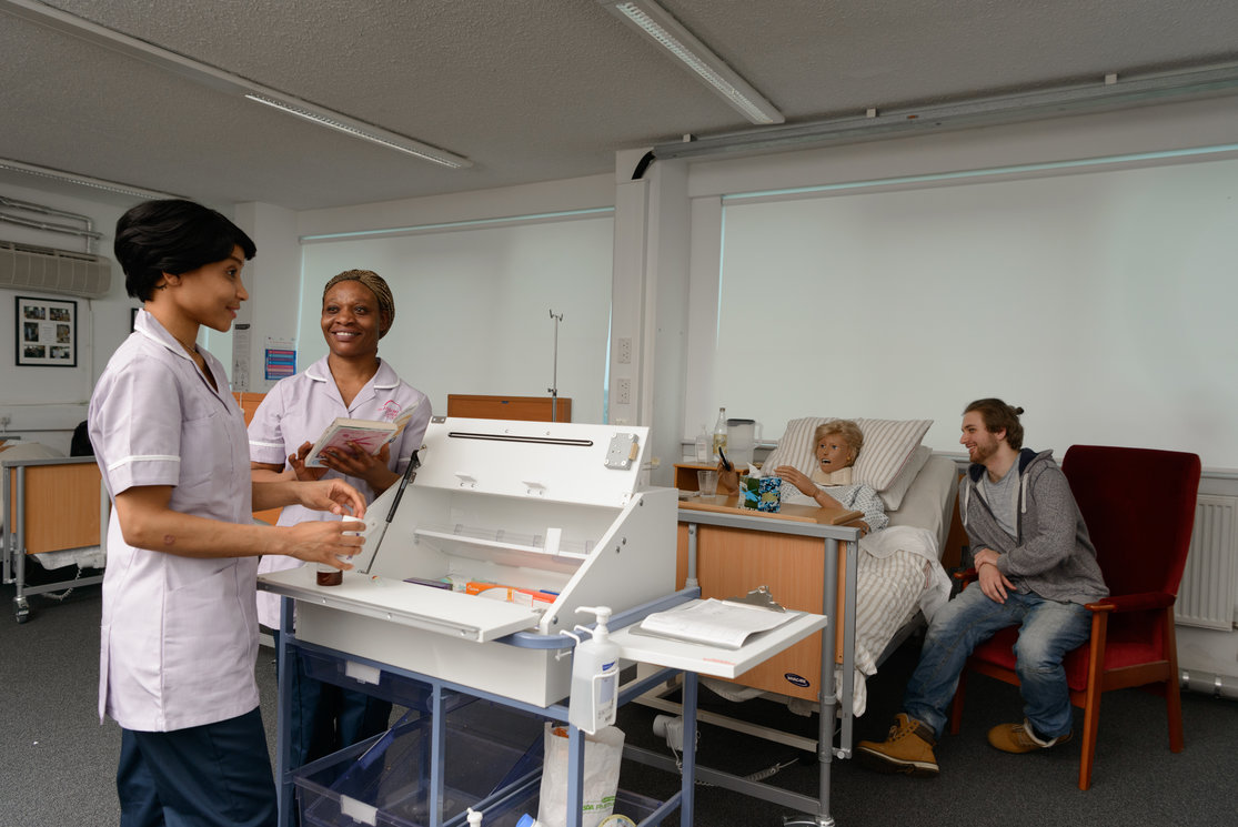 Esol transitions to health care   female students sorting medicine  image 2 gallery