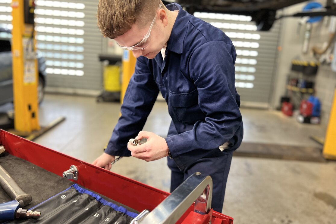 Student with tool box