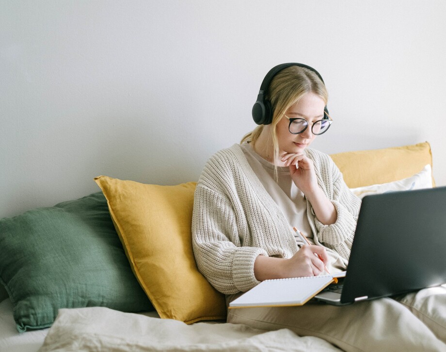 Student sitting working at laptop