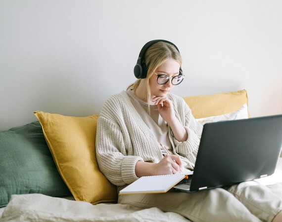 Student sitting working at laptop