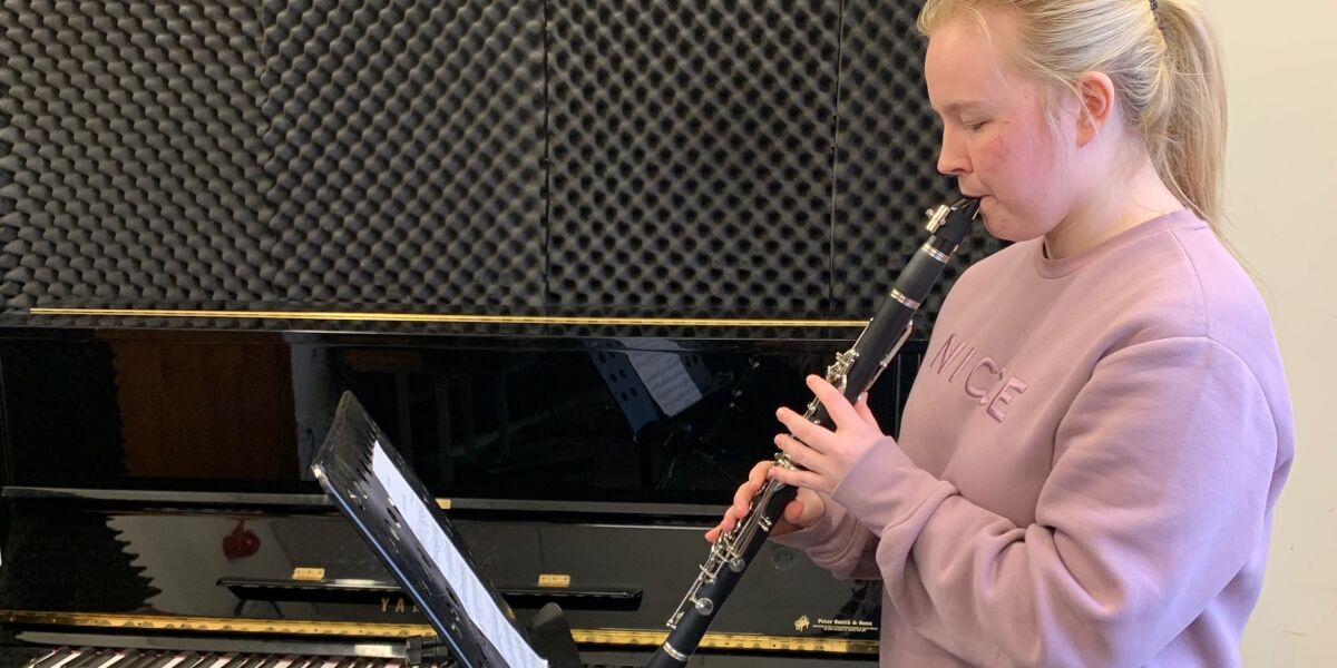 Music student playing the in sound studio