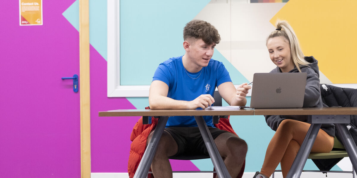 Glasgow Clyde College Business students studying together in the student area.