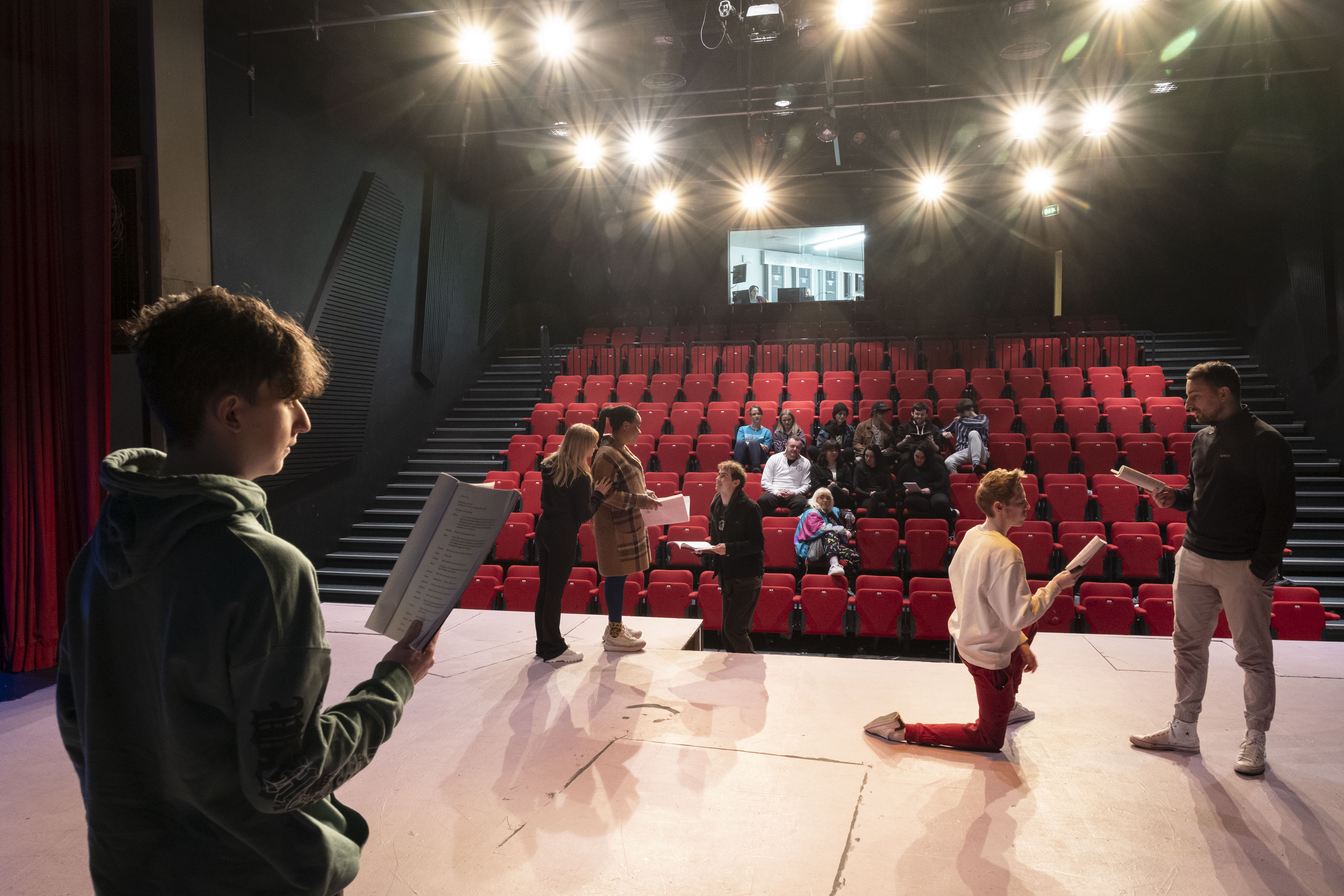 Glasgow Clyde College Acting and Performance students on stage in the Langside Theatre.