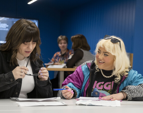 Two students sitting studying