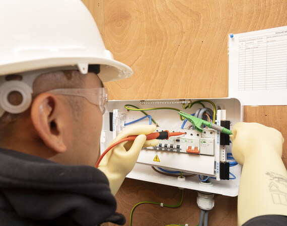 Electrical Engineering student working on wires