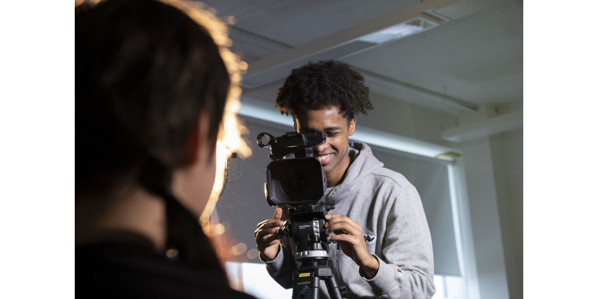 Media students filming close up shot