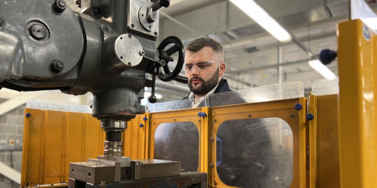 Male engineering student working with equipment