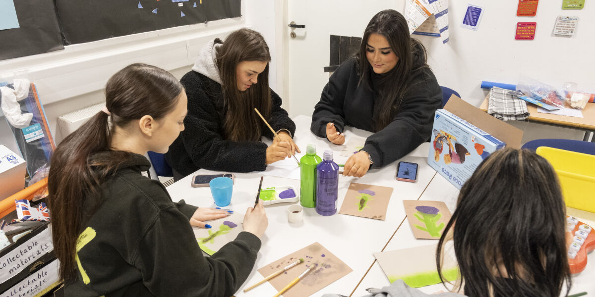 A group of Early Education students working around a table. 