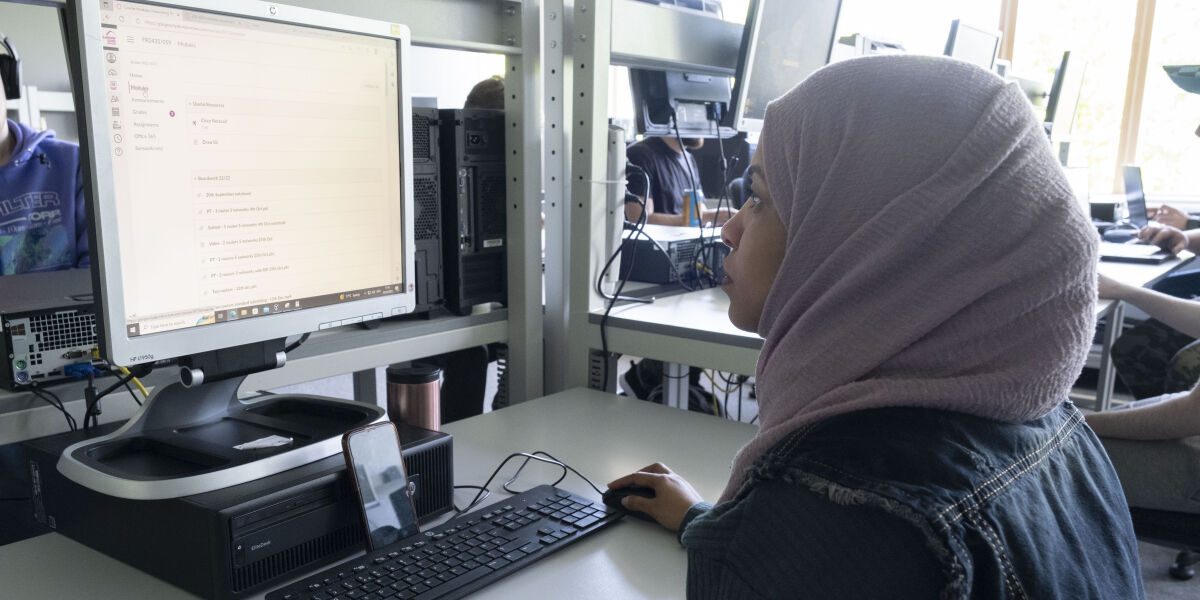 A student using a computer.