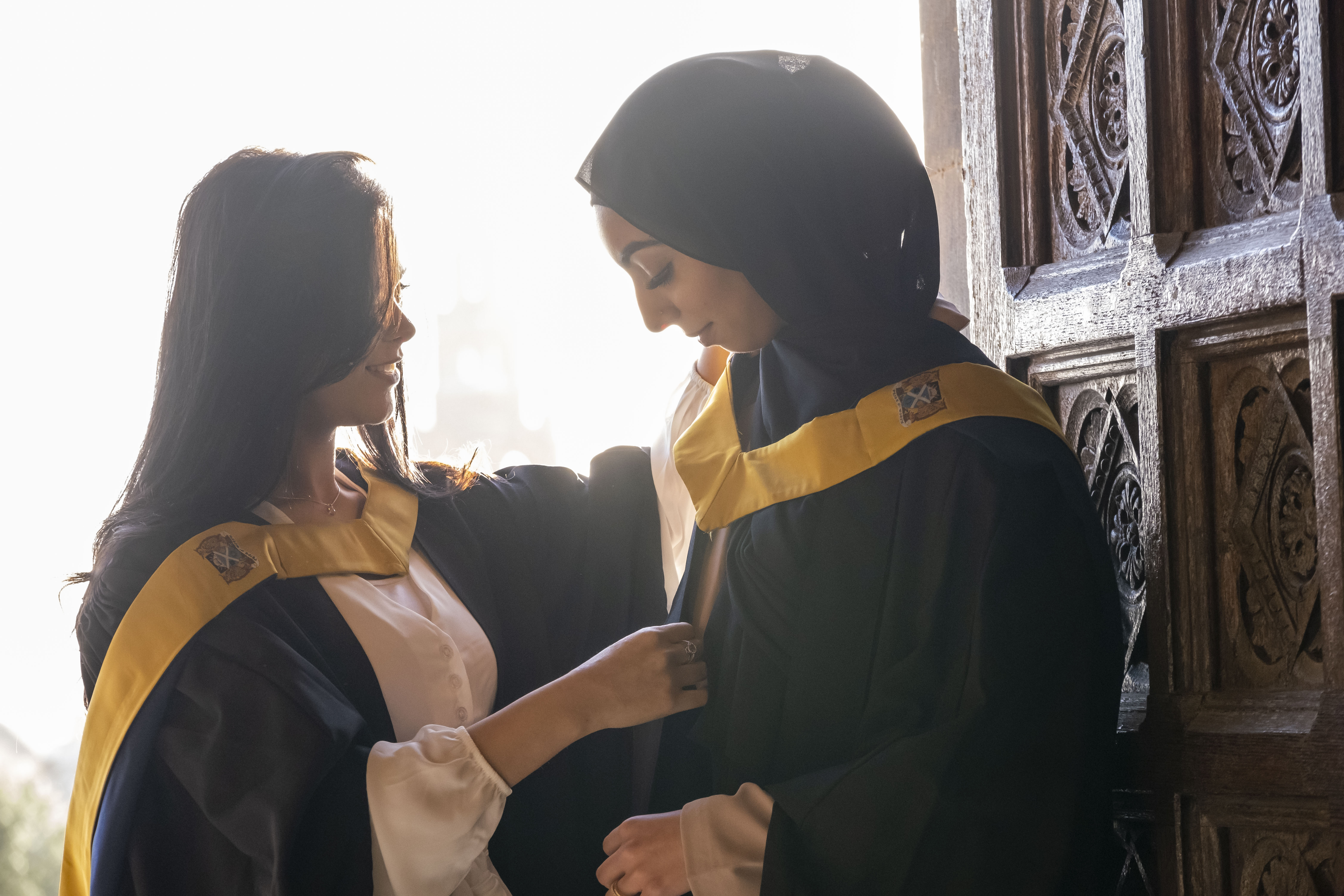Two female students in doorway