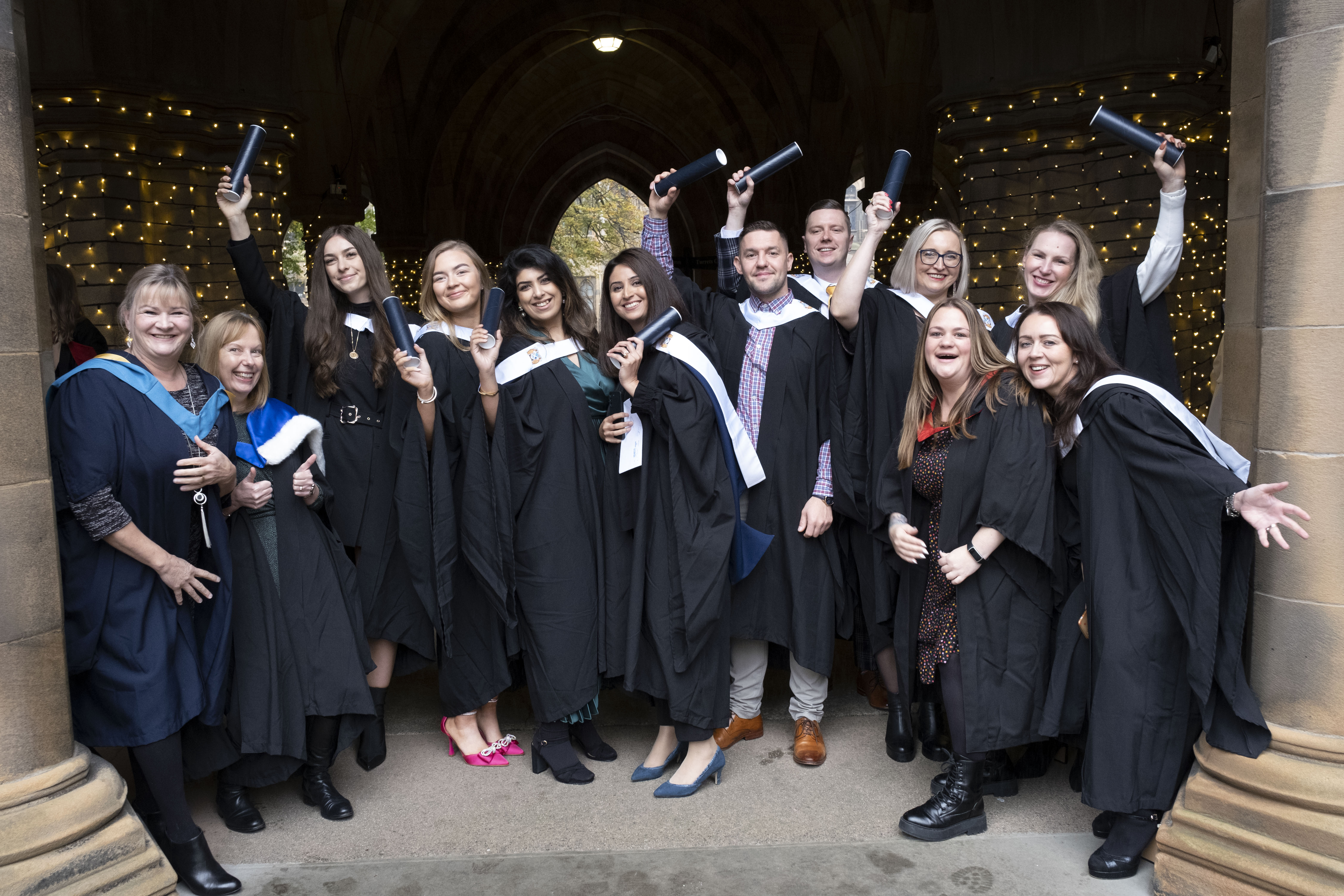 Class of graduates with scroll