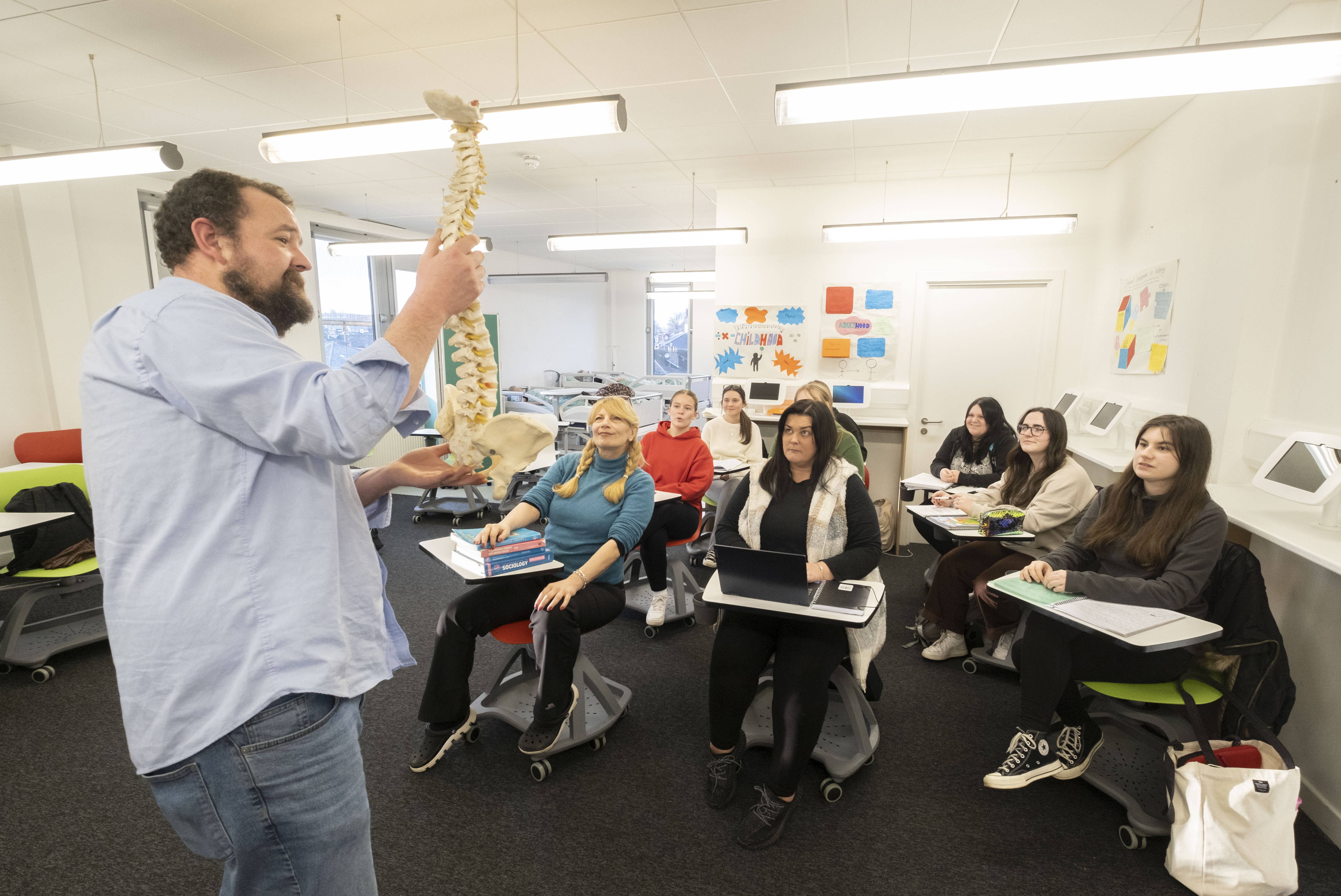 Occupational Therapy lecturer talking to a class of students. 