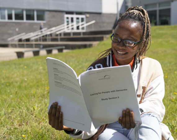 Social Care student reading class notes