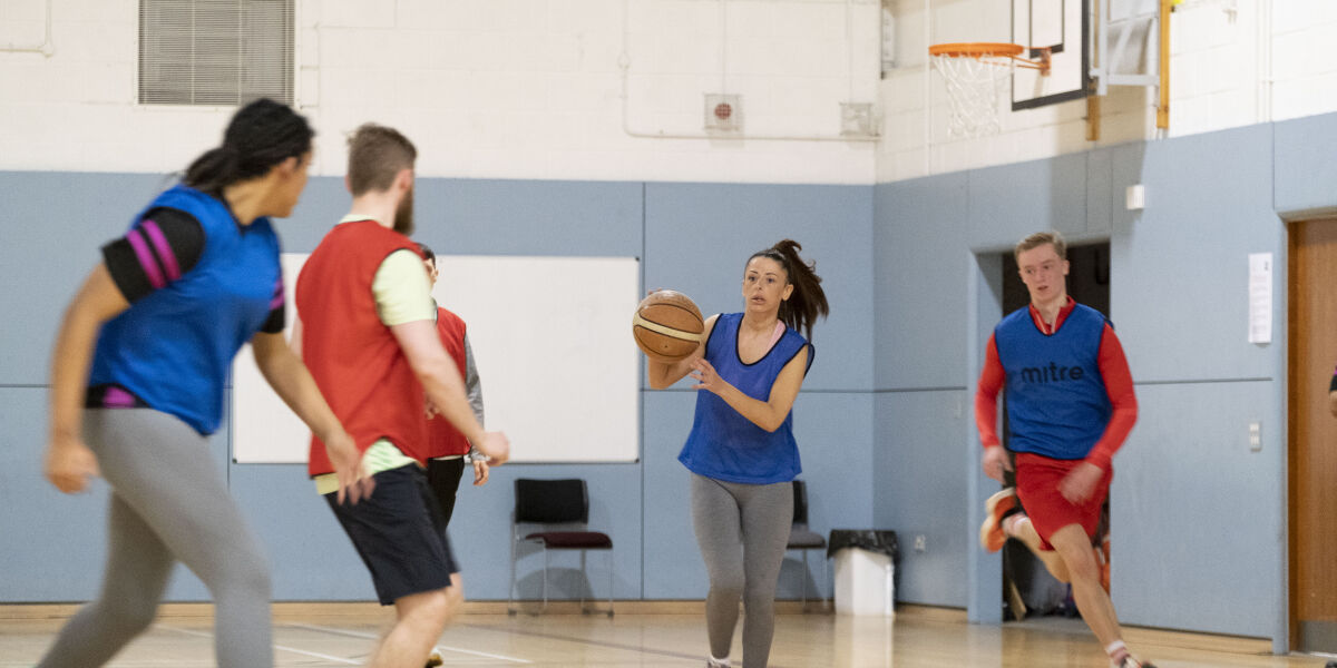 Students playing basketball 