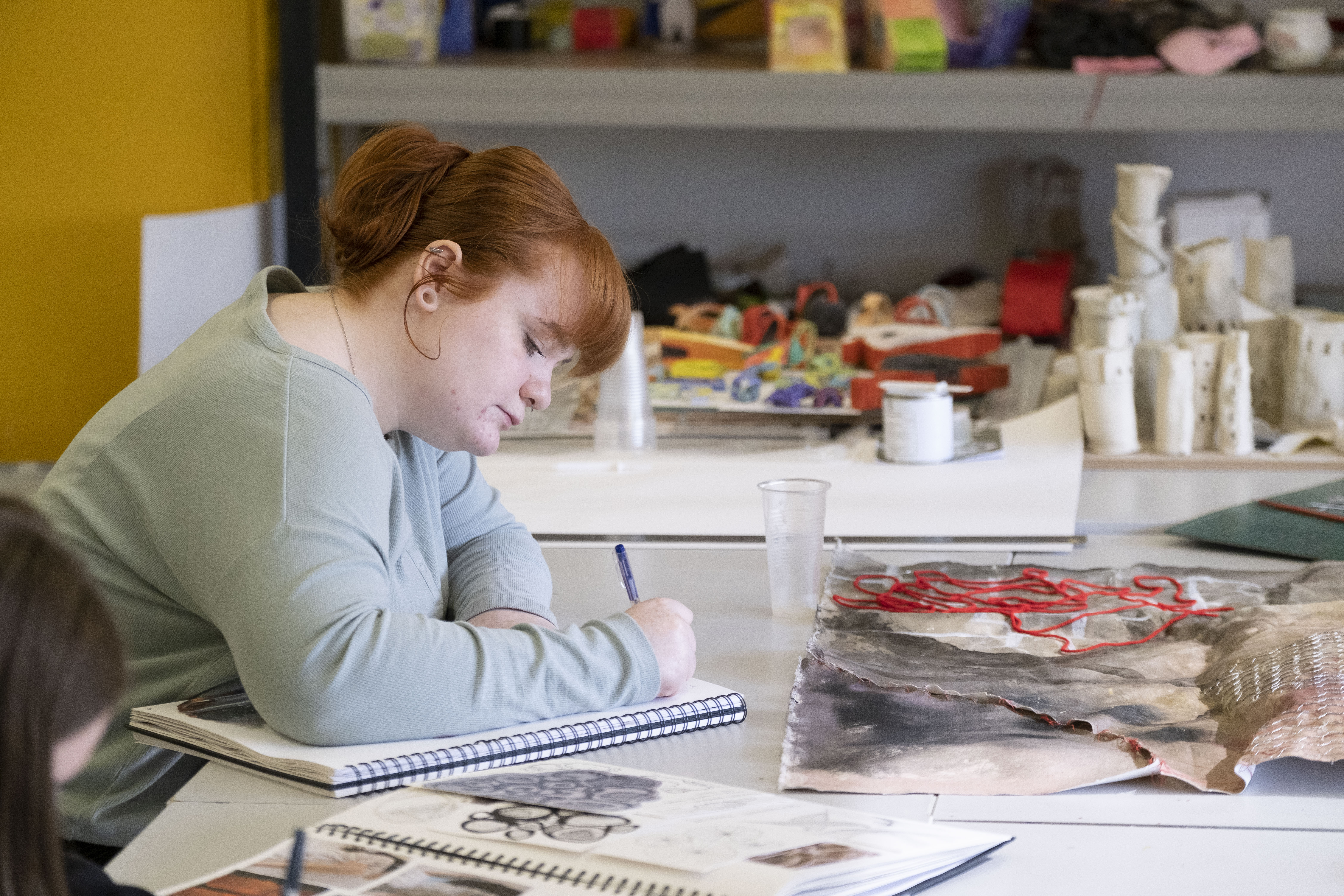 Glasgow Clyde College Art student working on sketches