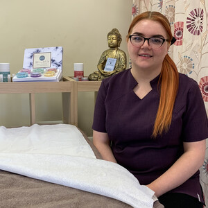 Glasgow Clyde College HND Beauty Therapy student Chelsie sitting in a beauty salon.