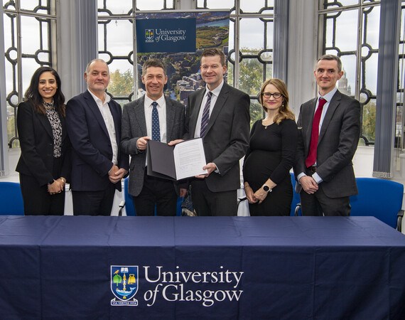 Jon Vincent signing MOU with University of Glasgow