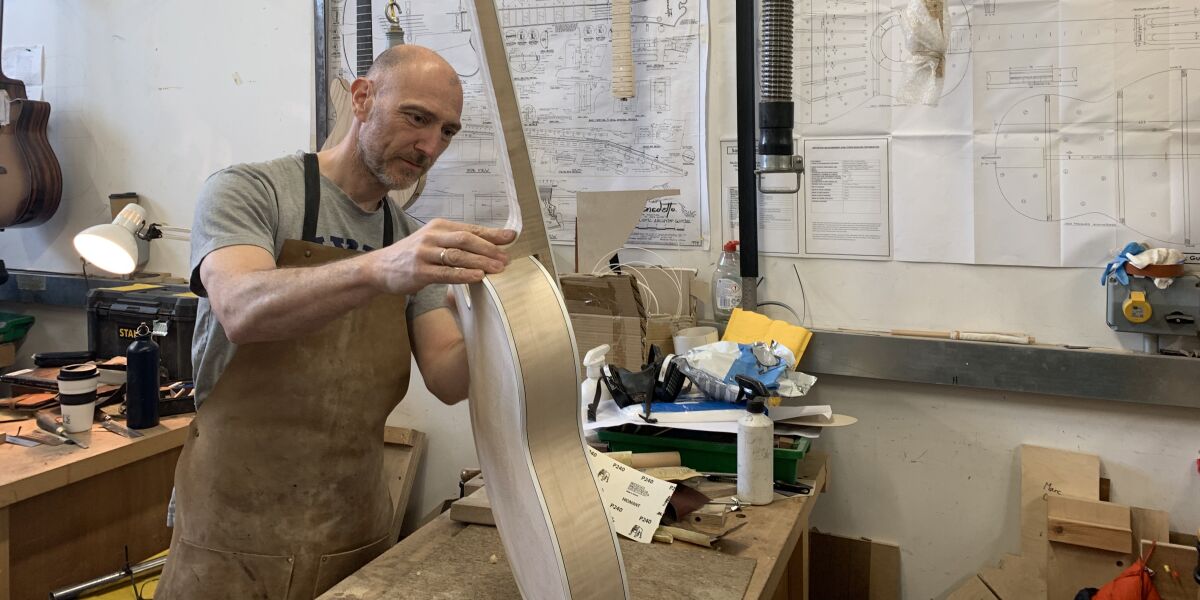 Student working on guitar