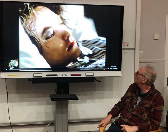 Image of Tim Pope featuring a still of Robert Smith from the music video for The Cure single Lullaby.