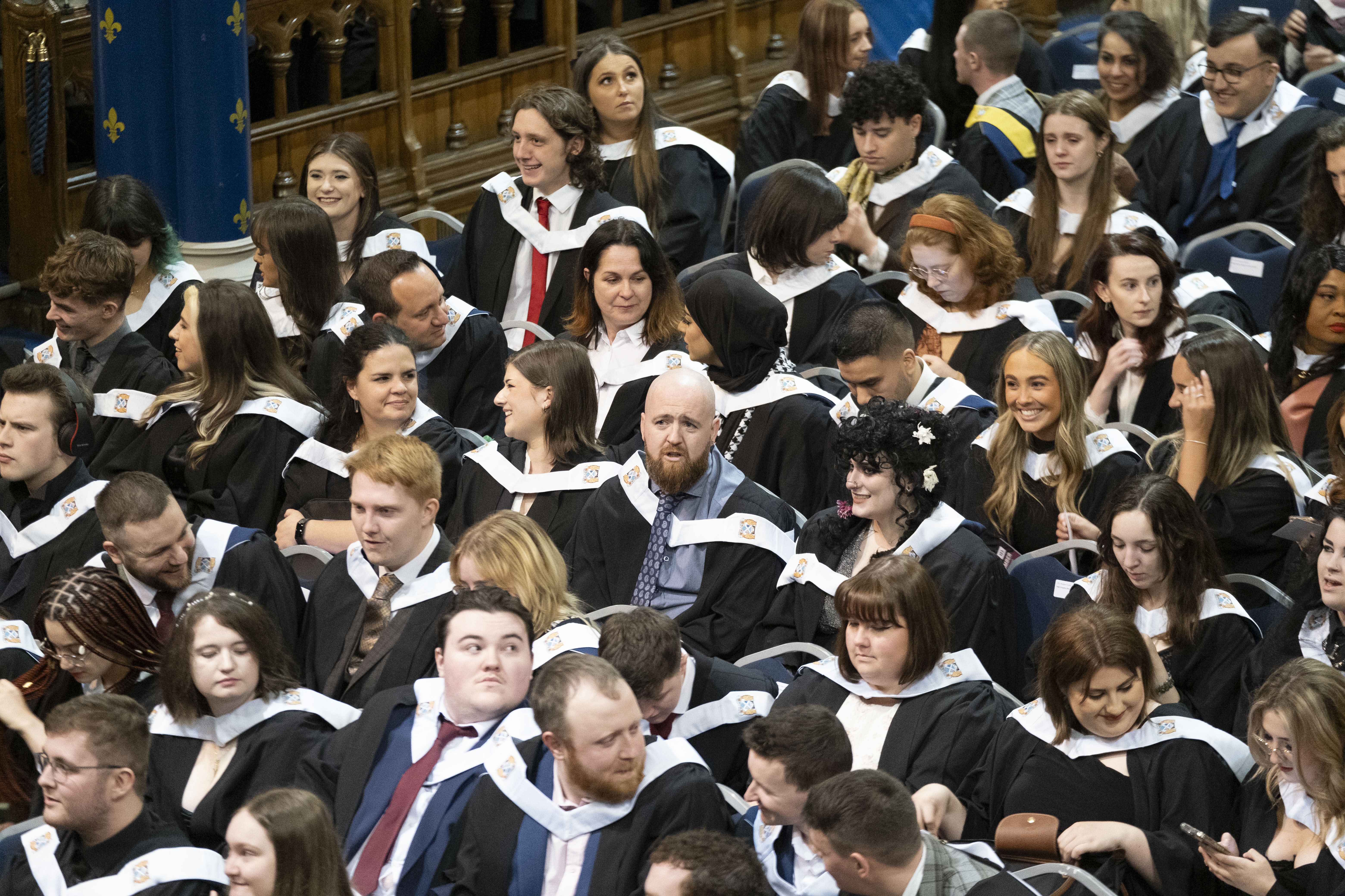 A group of graduates seated in the Bute Hall