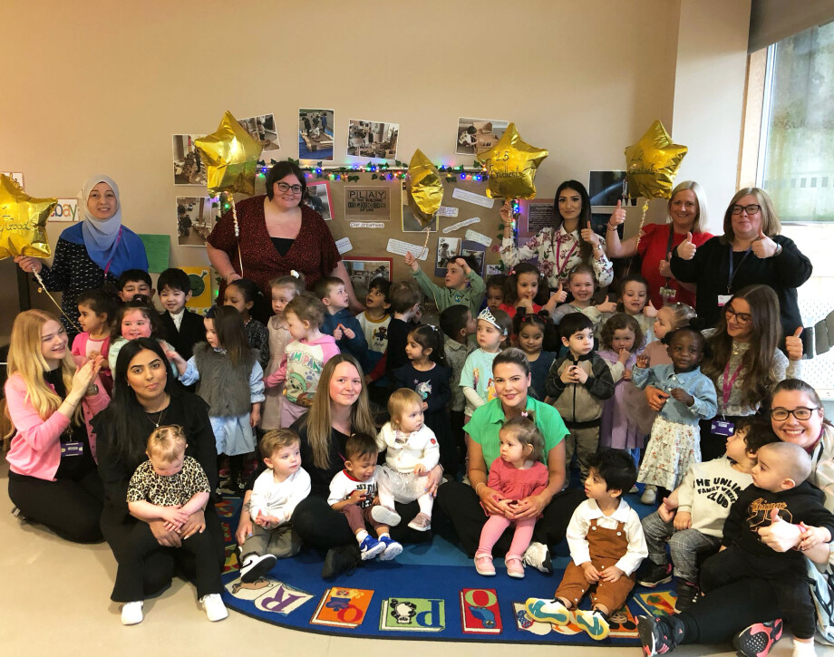 Image shows Treasure Trove Nursery staff and children celebrating