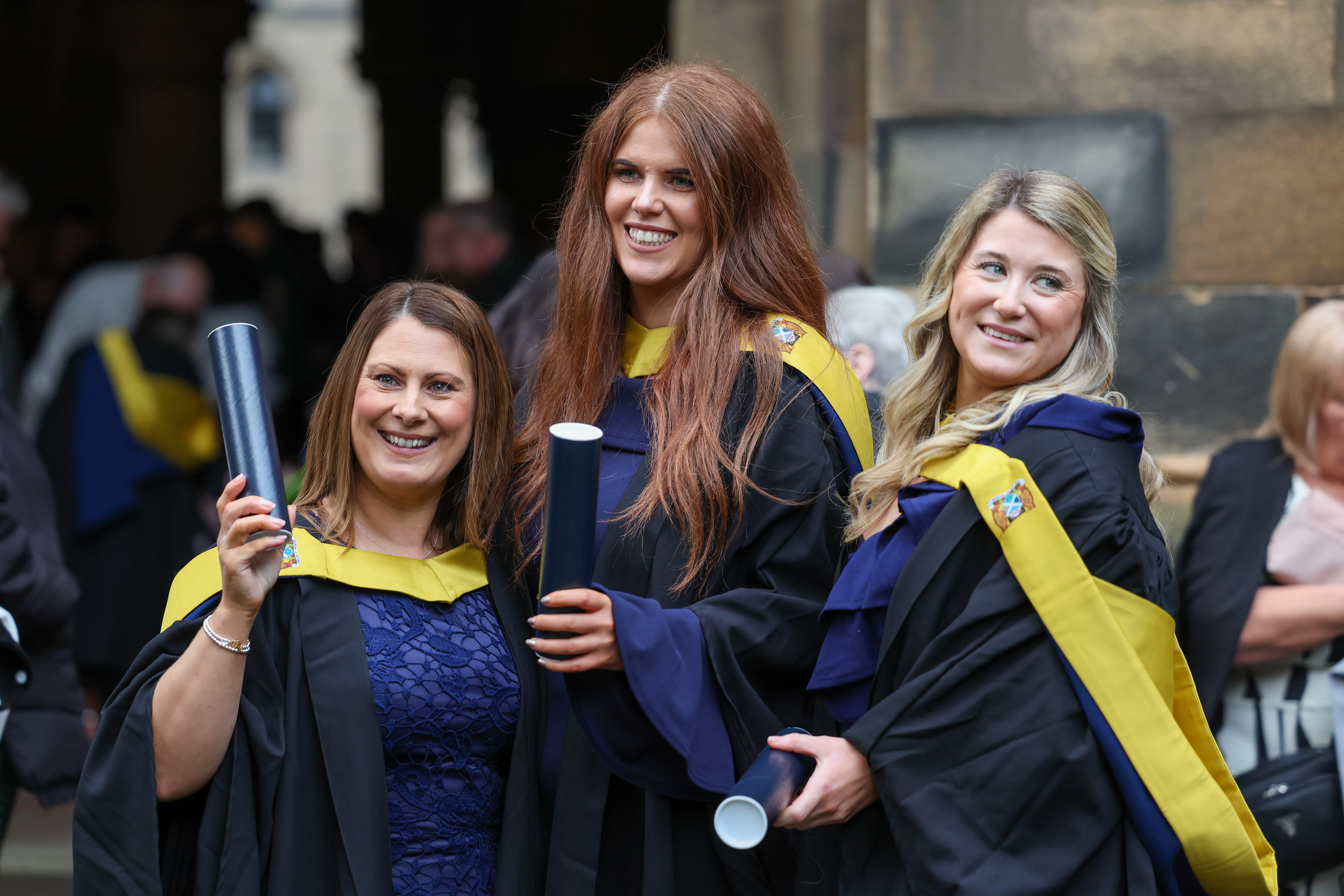Graduation image showing smiling female students outside
