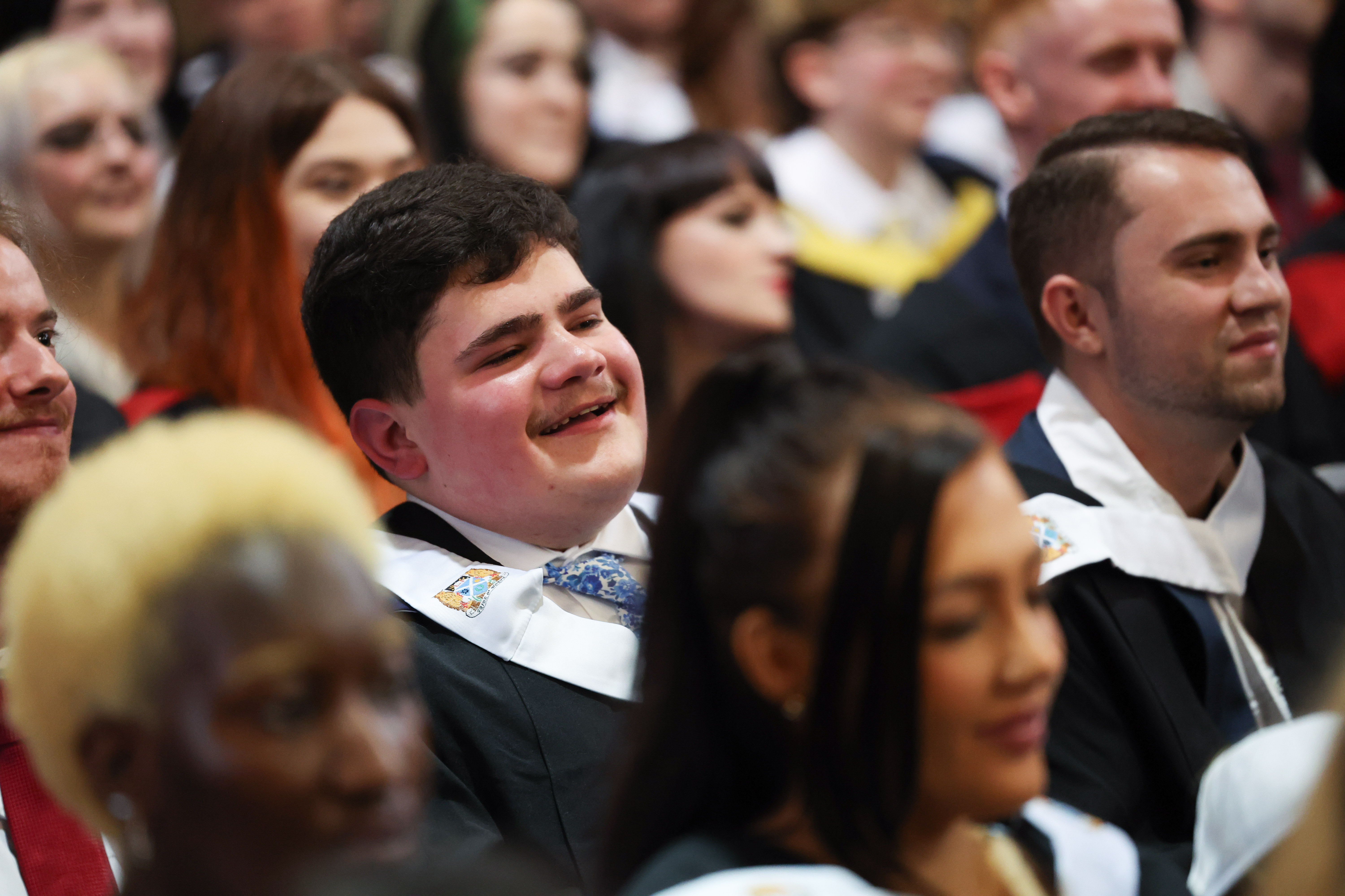 Graduation image showing smiling male students 2