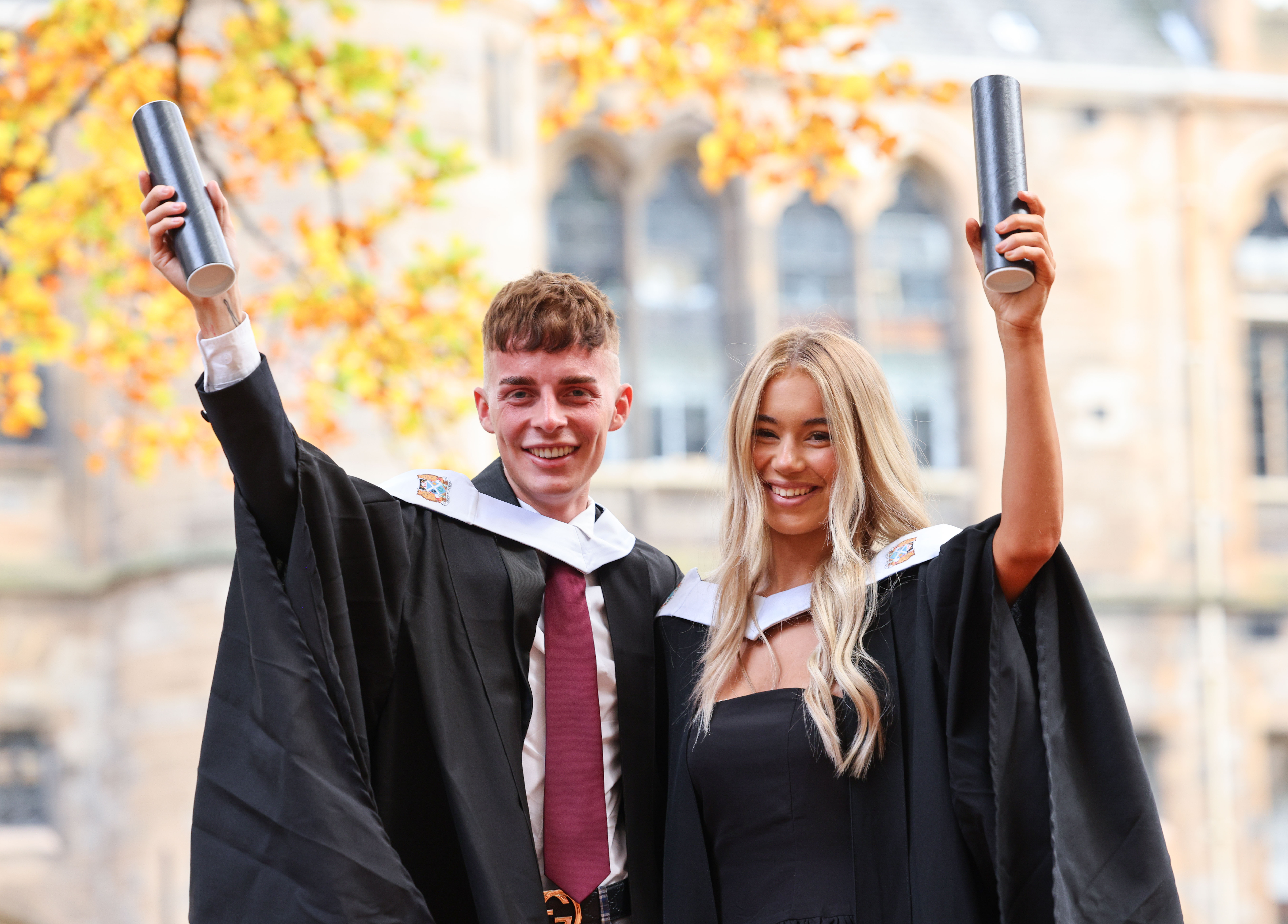 Graduation image showing a male and a female student