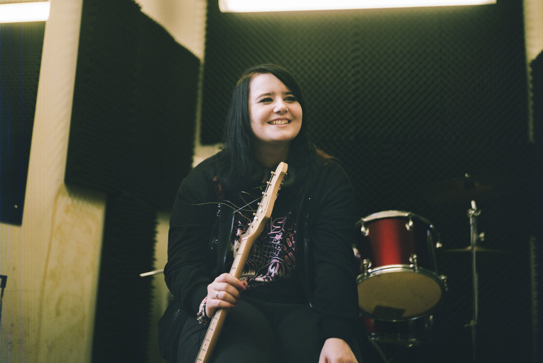 Guitar student in music studio gallery