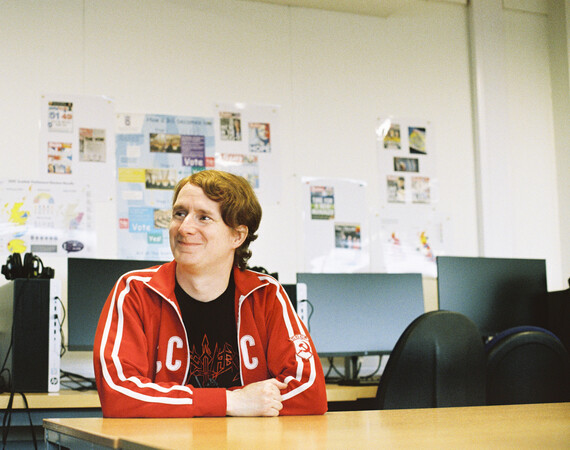 Student in a computer lab looking to the left