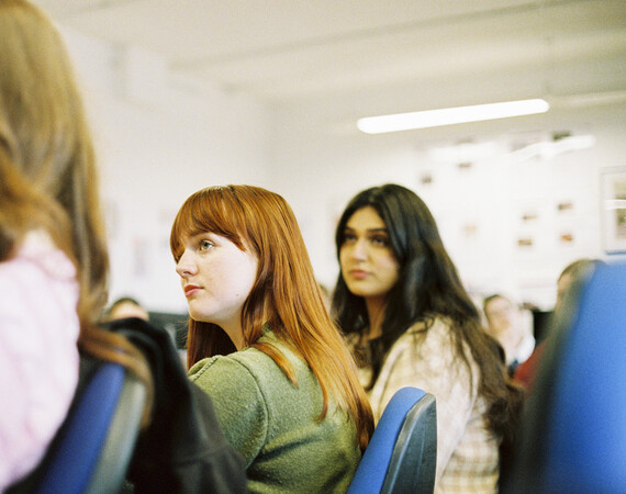 Group of female students in classroom.