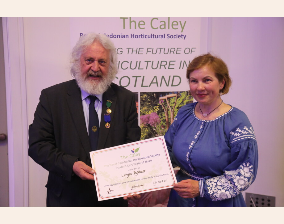 Image shows Larysa Dykhner being presented with the award