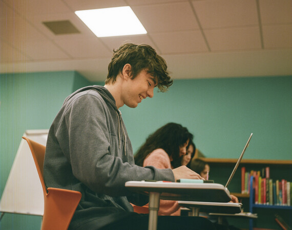 Boy at Desk on laptop 