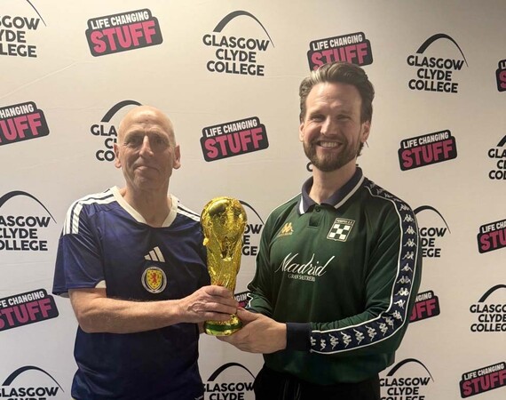 Image shows Hamish Husband and Craig Telfer with replica World Cup