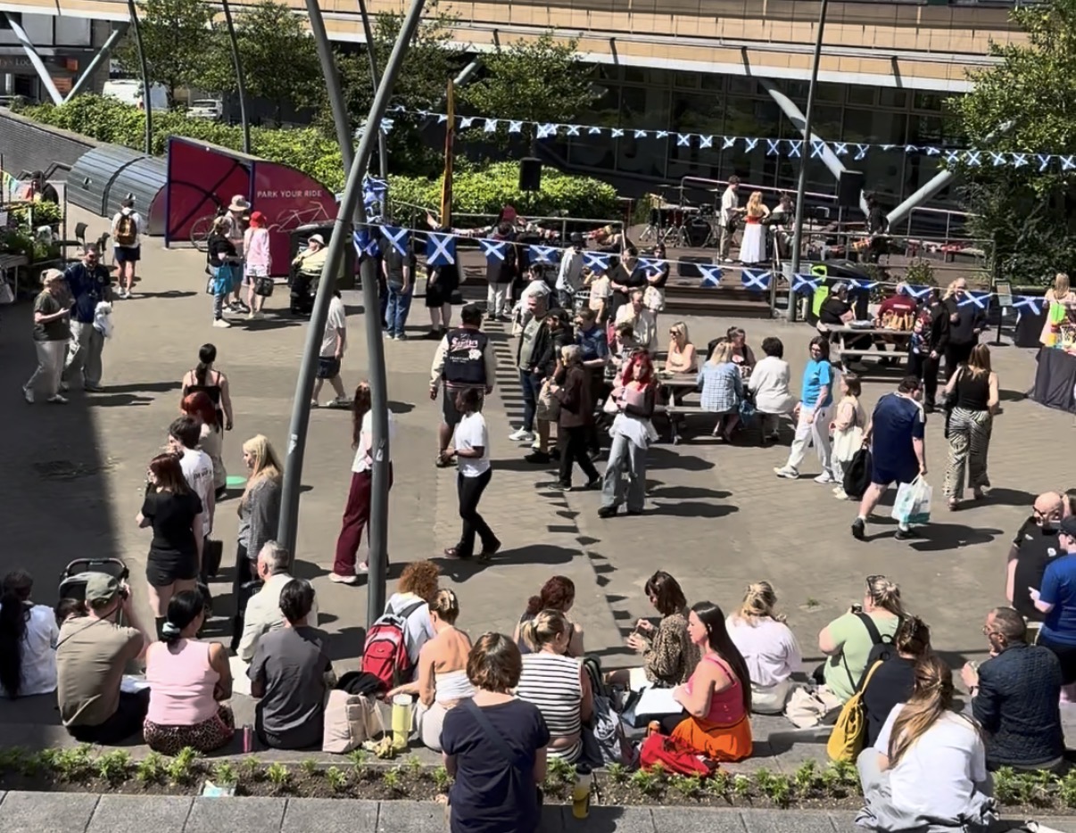 Group shot of students enjoying the summer festival in the sunshine