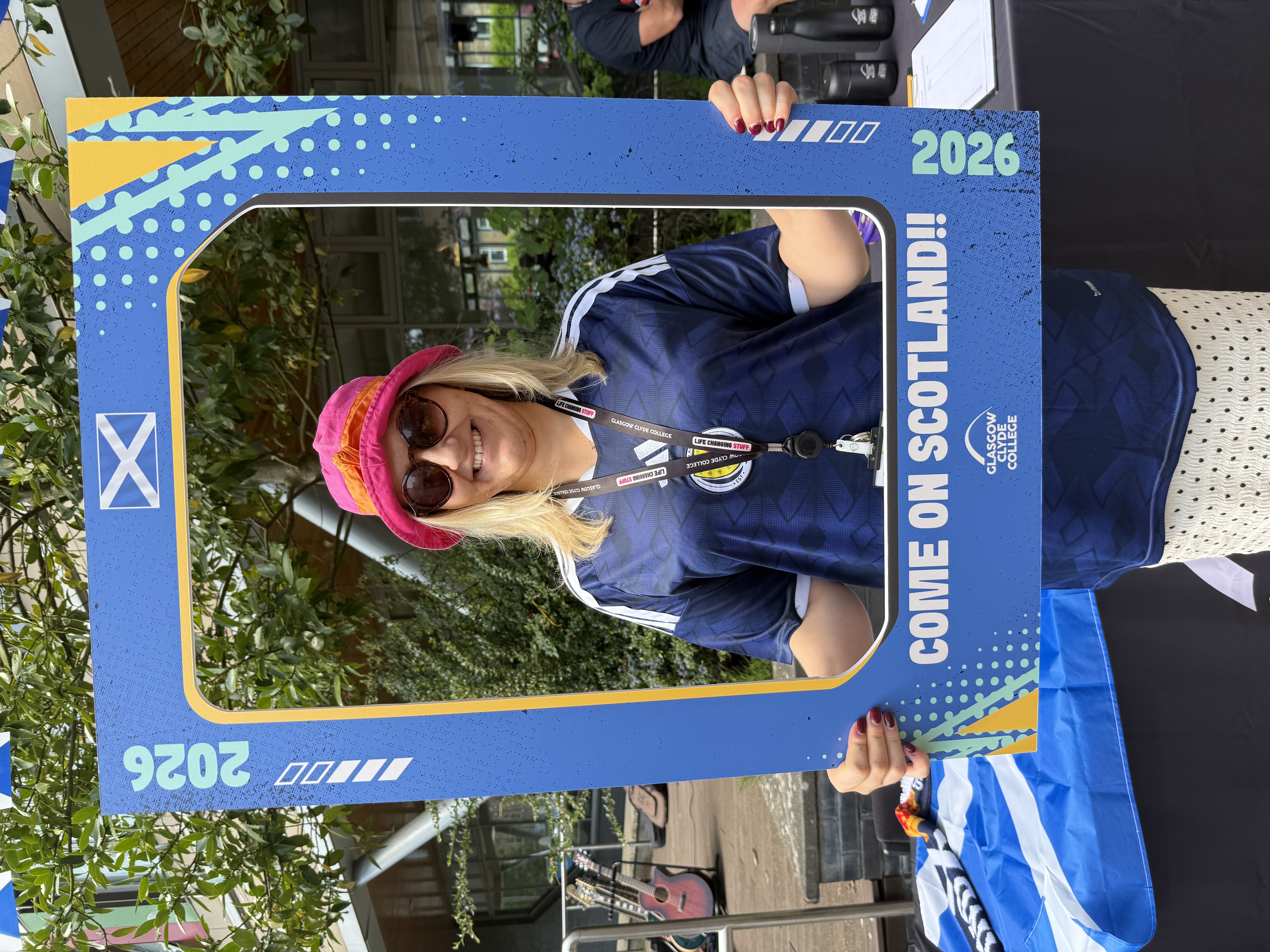 Staff member uses Panini cut out to recreate a sticker at the Summer Festival